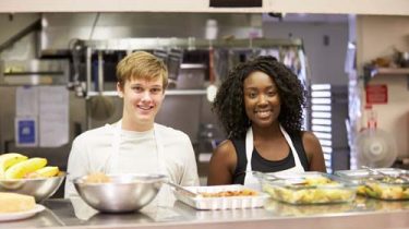 Two people volunteering